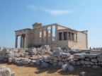  Erechtheion with the porch of the Caryatids.  The Sacred Olive Tree left of center  is supposedly descended from an original tree planted by Athena.
