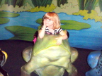  Lindsay rests with frog on lily pad at Cincinatti Children's  Museum